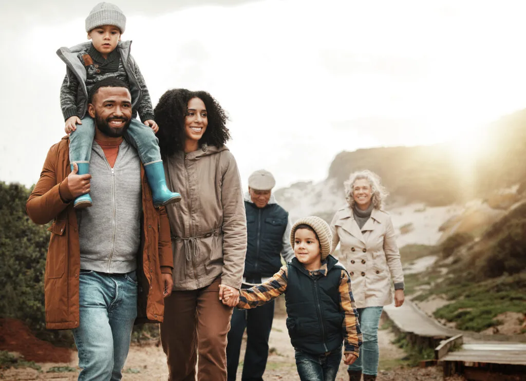 Family Going For A Walk In The Snowy Hills